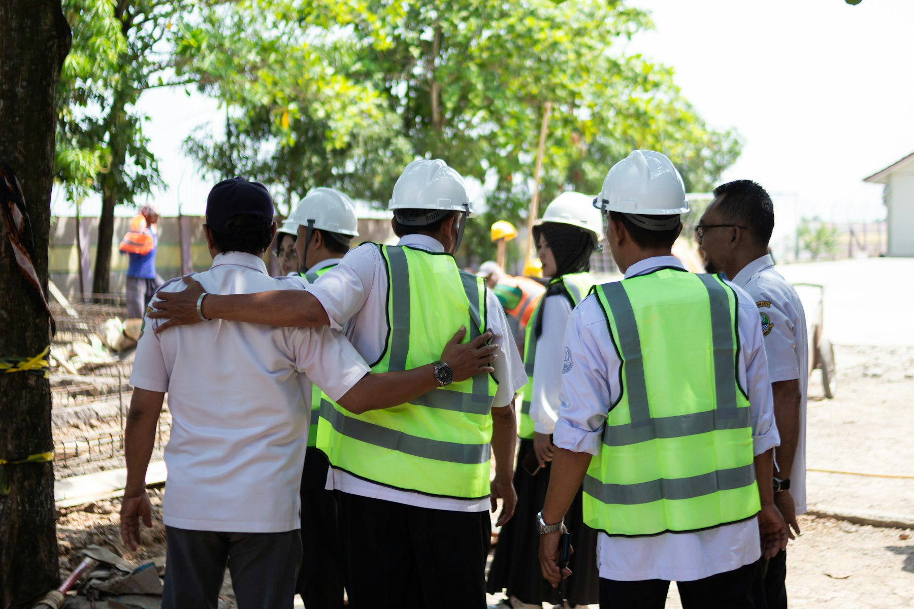 Field team in hard hats and safety vests
